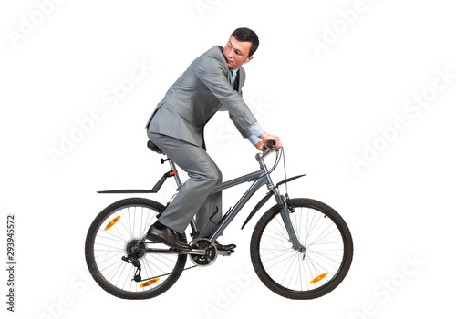 Young man in grey business suit on bike
