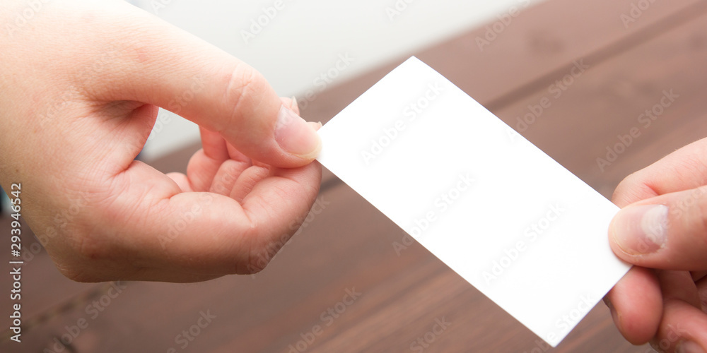 Obraz premium business executive exchanging business card blank. Copy space