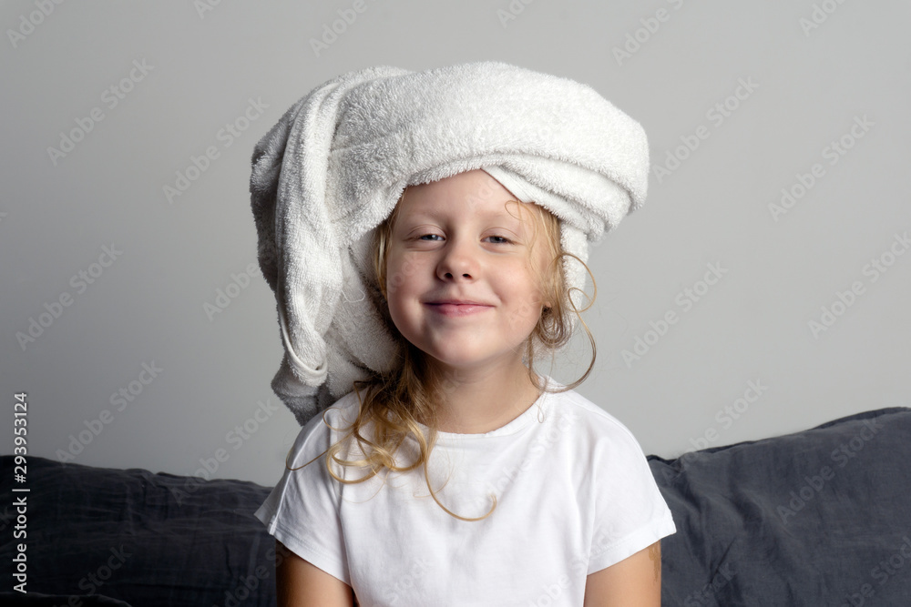 Smiling little girl in a towel after bath (shower) Smiling little girl in a towel after bath (shower)