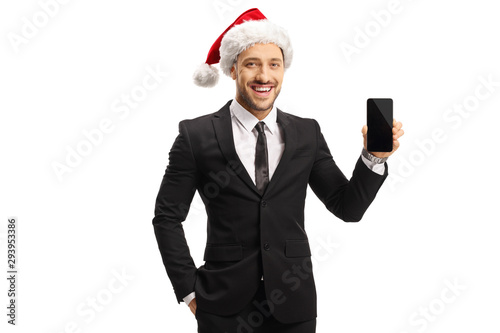 Businessman wearing a santa claus hat holding a mobile phone © Ljupco Smokovski