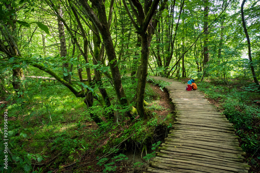 True Love 3years old girl and 5years old boy sitting on the wooden