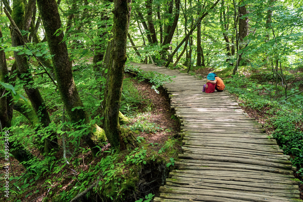 True Love 3years old girl and 5years old boy sitting on the wooden