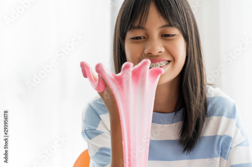 Hand Holding Homemade Toy Called Slime, Kids having fun and being creative by science experiment