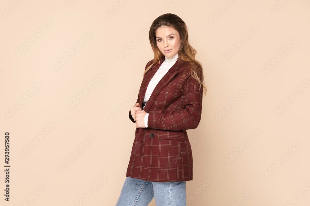Friendly smiling woman posing in studio. Friendly smiling woman posing in studio.