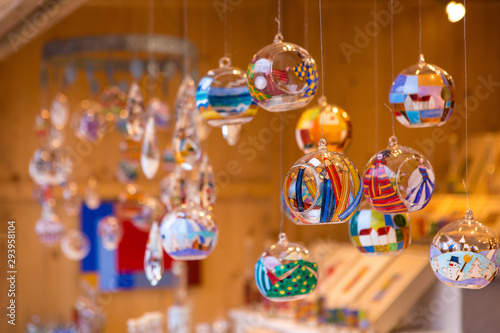 Photography Christmas souvenirs on the counter in Europe, Painted glass Christmas balls with fairy tales
