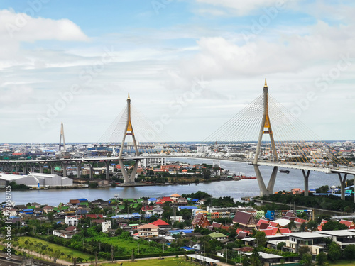 Bhumibol Bridge with river, cityscape view and cloudy blue sky in the morning.