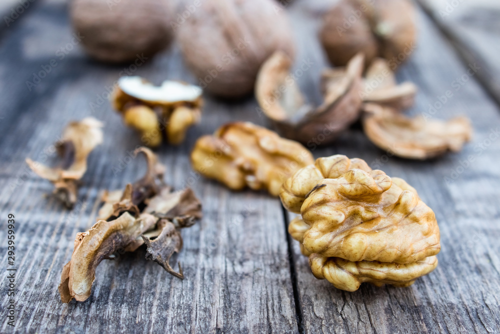 Walnuts kernels on a rustic old wooden table. Fresh walnuts.