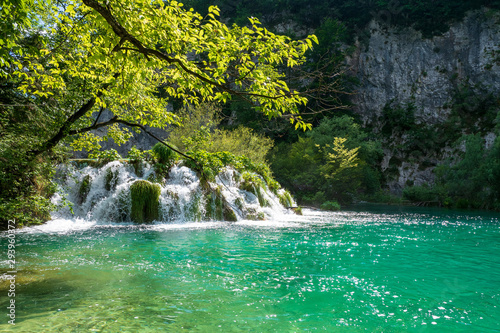 Rushing water cascades down the natural barriers into the crystal clear and azure coloured Lake Gavanovac at the Plitvice Lakes National Park, Croatia © schusterbauer.com