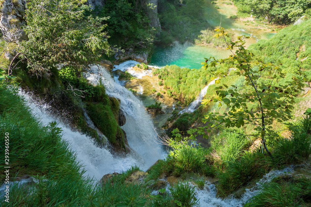 Stunning view of thunderous water masses rushing over the edge of a cliff at the Plitvice Lakes National Park, Plitvička Jezera, Croatia Stunning view of thunderous water masses rushing over the edge of a cliff at the Plitvice Lakes National Park, Plitvička Jezera, Croatia