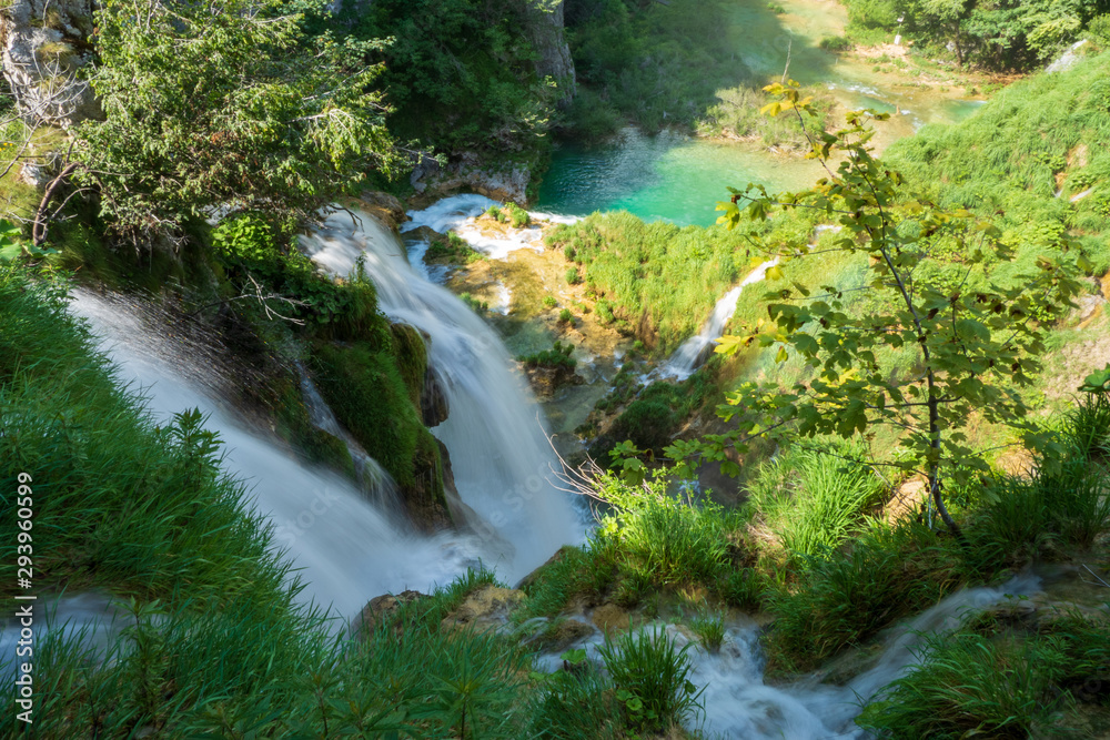 Stunning view of thunderous water masses rushing over the edge of a cliff at the Plitvice Lakes National Park, Plitvička Jezera, Croatia Stunning view of thunderous water masses rushing over the edge of a cliff at the Plitvice Lakes National Park, Plitvička Jezera, Croatia