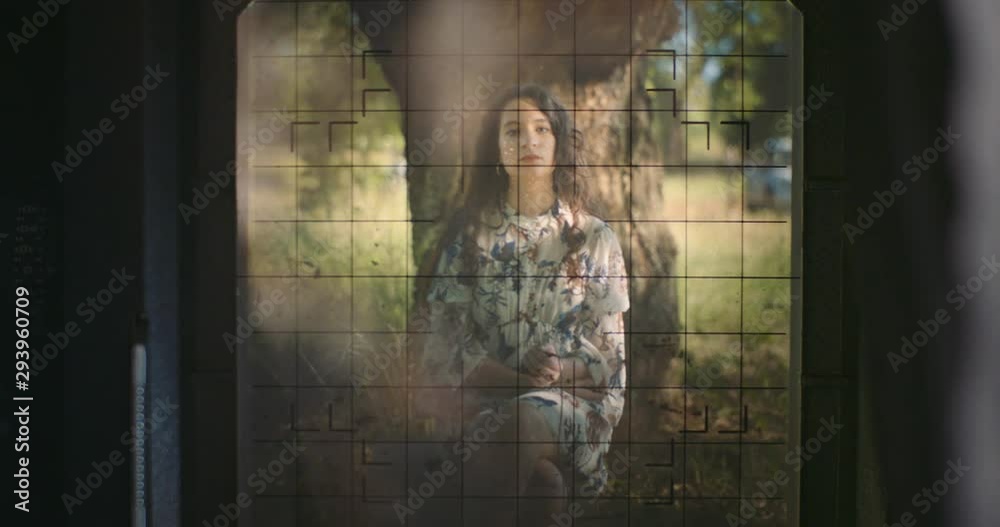 young woman setting up large format camera in nature young woman setting up large format camera in nature