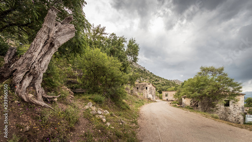 road through abandoned earthquake village Palia Plagia in Greece, with ruined houses