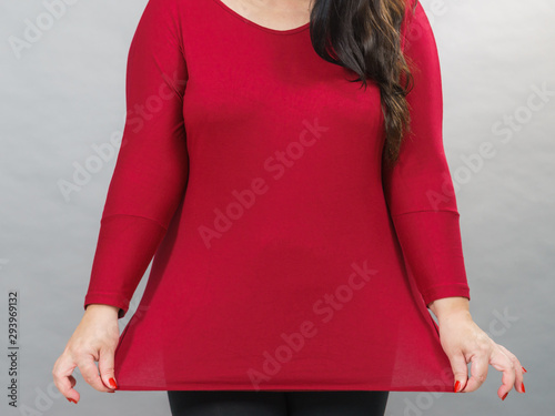 Obraz na plátně Woman plus size in red tunic