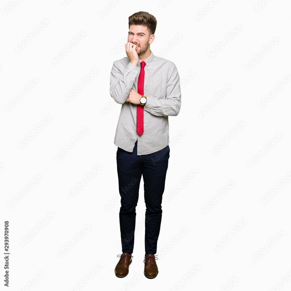 Young handsome business man looking stressed and nervous with hands on mouth biting nails. Anxiety problem. Young handsome business man looking stressed and nervous with hands on mouth biting nails. Anxiety problem.