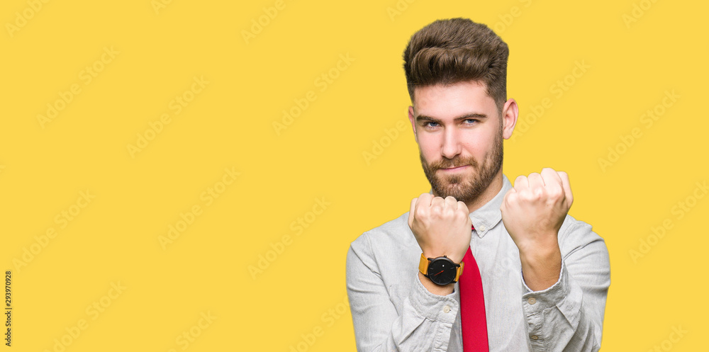 Young handsome business man Ready to fight with fist defense gesture, angry and upset face, afraid of problem