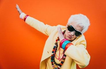 Funny grandmother portraits. Senior old woman dressing elegant for a special event. granny fashion model on colored backgrounds