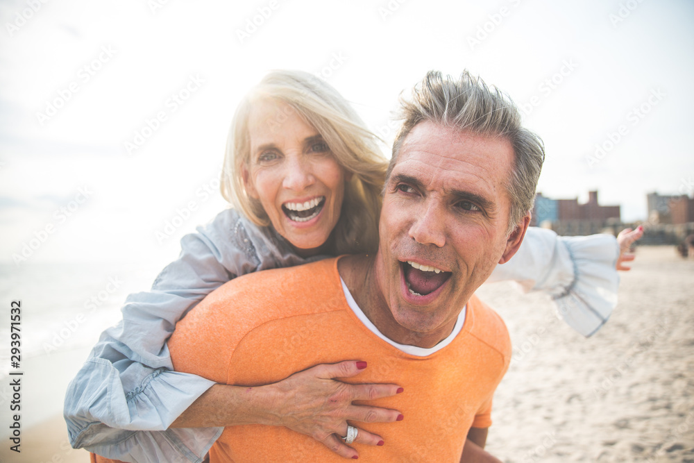 Happy senior couple spending time at the beach. Concepts about love,seniority and people Happy senior couple spending time at the beach. Concepts about love,seniority and people