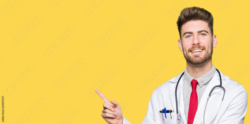 Young handsome doctor man wearing medical coat with a big smile on face, pointing with hand and finger to the side looking at the camera. Young handsome doctor man wearing medical coat with a big smile on face, pointing with hand and finger to the side looking at the camera.