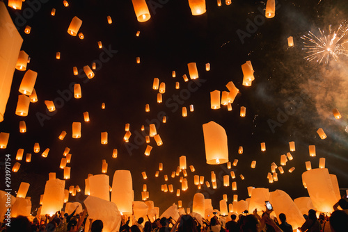 Loy krathong festival, thai new year party with floating lanterns release in the night sky