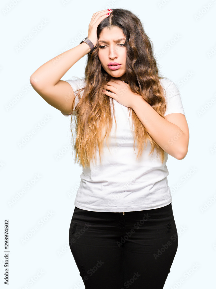 Young beautiful woman wearing casual white t-shirt Touching forehead for illness and fever, flu and cold, virus sick Young beautiful woman wearing casual white t-shirt Touching forehead for illness and fever, flu and cold, virus sick