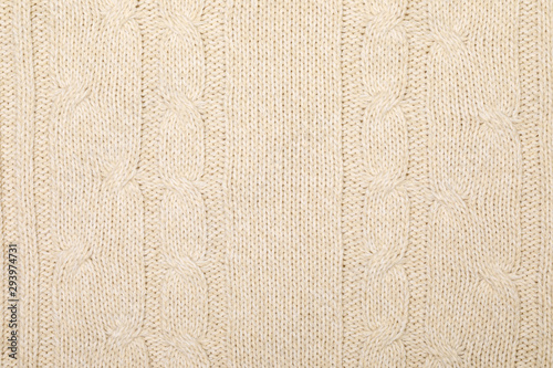 Beige melange cable knitting fabric textured background