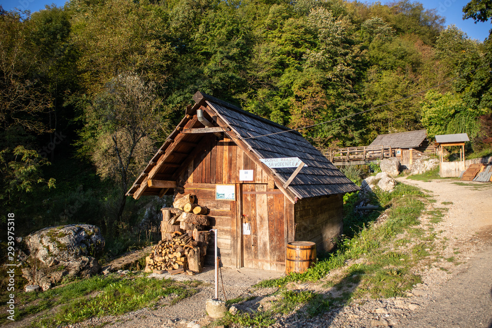 Small wooden houses by the river on popular picnic place Krupa na Vrbasu near the Banja Luka in Bosnia and Herzegovina
