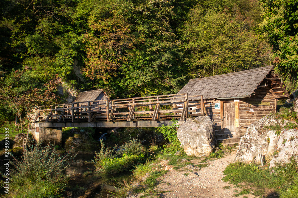 Small wooden houses by the river on popular picnic place Krupa na Vrbasu near the Banja Luka in Bosnia and Herzegovina