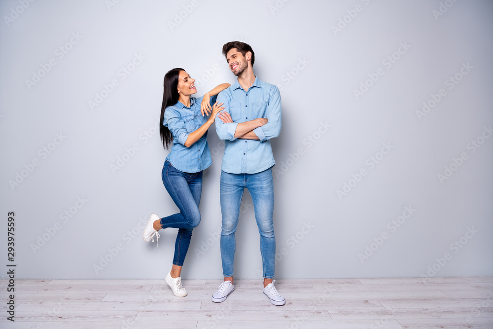 Full body photo of amazing pair in love working together spend coffee break chatting wear casual jeans clothes isolated grey color background Full body photo of amazing pair in love working together spend coffee break chatting wear casual jeans clothes isolated grey color background