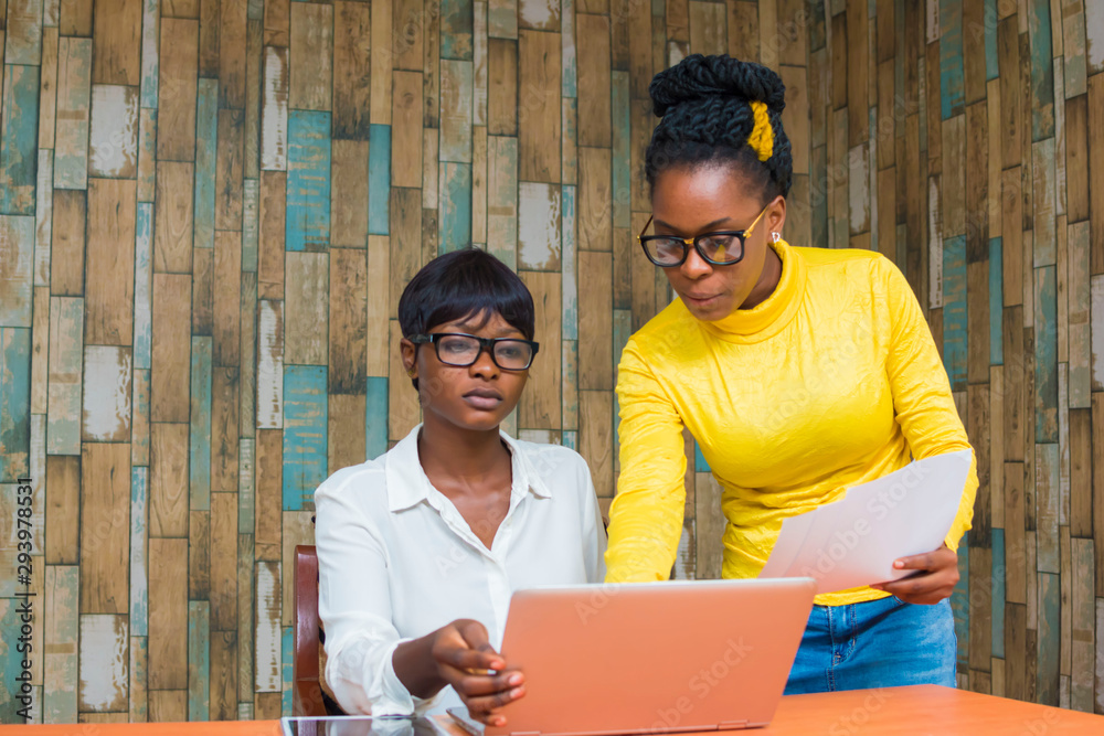 Group of young African Entrepreneur holding a board meeting taking decision about their next big project Group of young African Entrepreneur holding a board meeting taking decision about their next big project