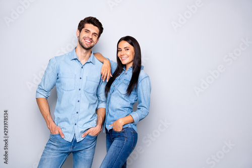 Portrait of his he her she nice-looking attractive charming lovely cheerful cheery content couple wearing casual standing together posing isolated on light white gray pastel color background