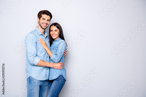 Portrait of his he her she nice attractive charming lovely cheerful cheery couple wearing casual embracing copy empty blank place space isolated over light white gray pastel color background