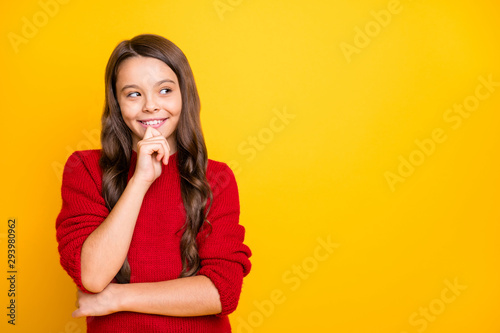 Portrait of minded cunning sly model girl think have plans choose decide trick for her friends wear style red pullover isolated over yellow color background