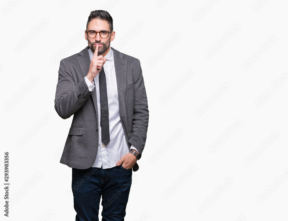 Young handsome business man over isolated background asking to be quiet with finger on lips. Silence and secret concept. Young handsome business man over isolated background asking to be quiet with finger on lips. Silence and secret concept.