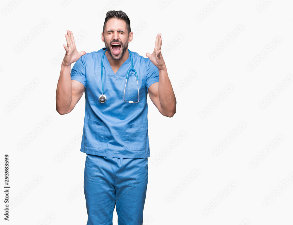 Handsome young doctor surgeon man over isolated background celebrating mad and crazy for success with arms raised and closed eyes screaming excited. Winner concept Handsome young doctor surgeon man over isolated background celebrating mad and crazy for success with arms raised and closed eyes screaming excited. Winner concept