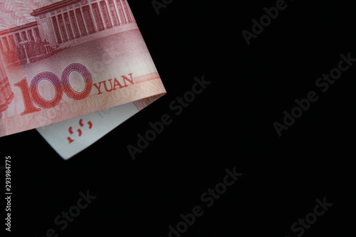 money in an envelope on a black background with space for text