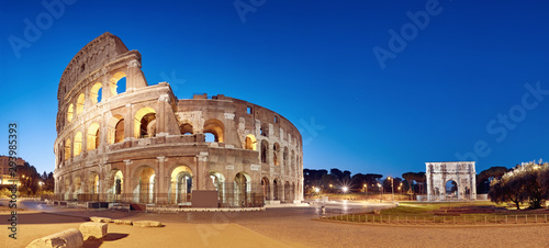 Colosseum (Coliseum) in Rome, Italy, at nigh, panoramic image