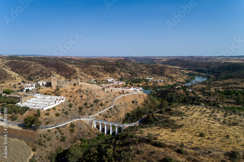 Aerial view of the beautiful village of Mértola in Alentejo, Portugal; Concept for travel in Portugal and Portuguese historical villages. photo