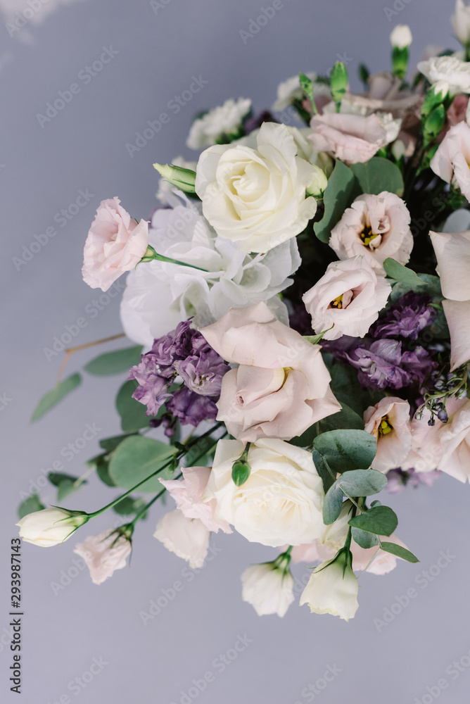 Beautiful fresh flowers on the wedding table. Stylish floristics at a classic wedding