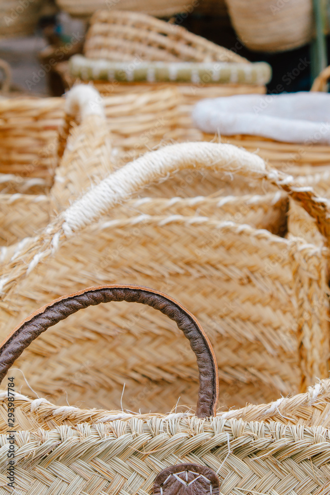 Handmade wicker baskets at a street fair. The concept of craft products, selling unique things, traditional culture. Ecological baskets not to consume plastic and go shopping