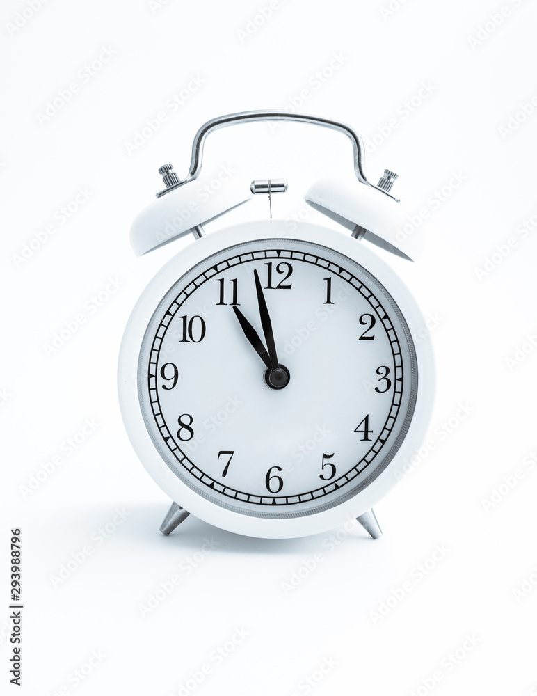 White clock on white background, time 11 a.m. Calm and cheerful morning concept. White clock on white background, time 11 a.m. Calm and cheerful morning concept.