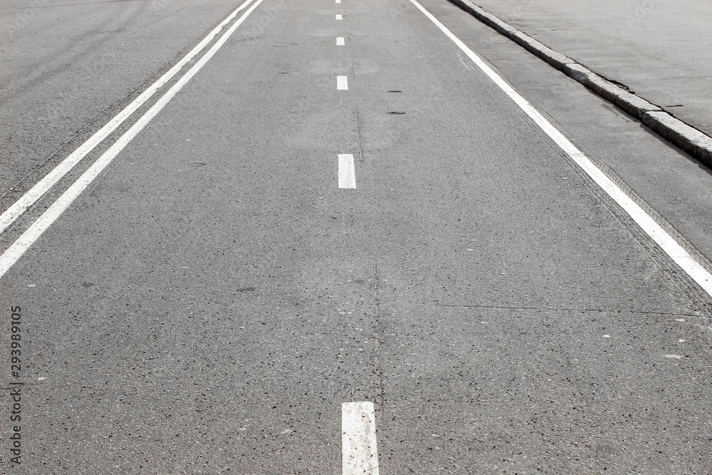 An empty road with white road marking