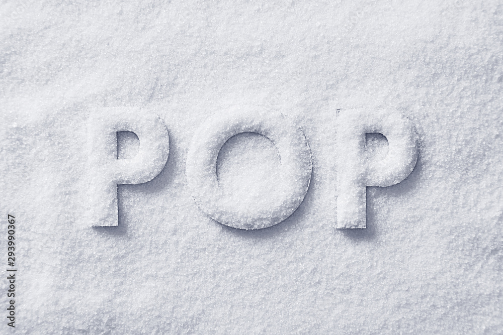 Pop letters on a sugar background viewed from above. Sugar pop concept. Top view