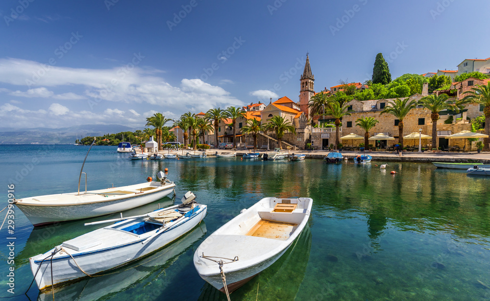 Fishing boats in Splitska village with beautiful port, Brac island, Croatia. Village of Splitska on Brac island seafront view, Dalmatia, Croatia, Croatia.