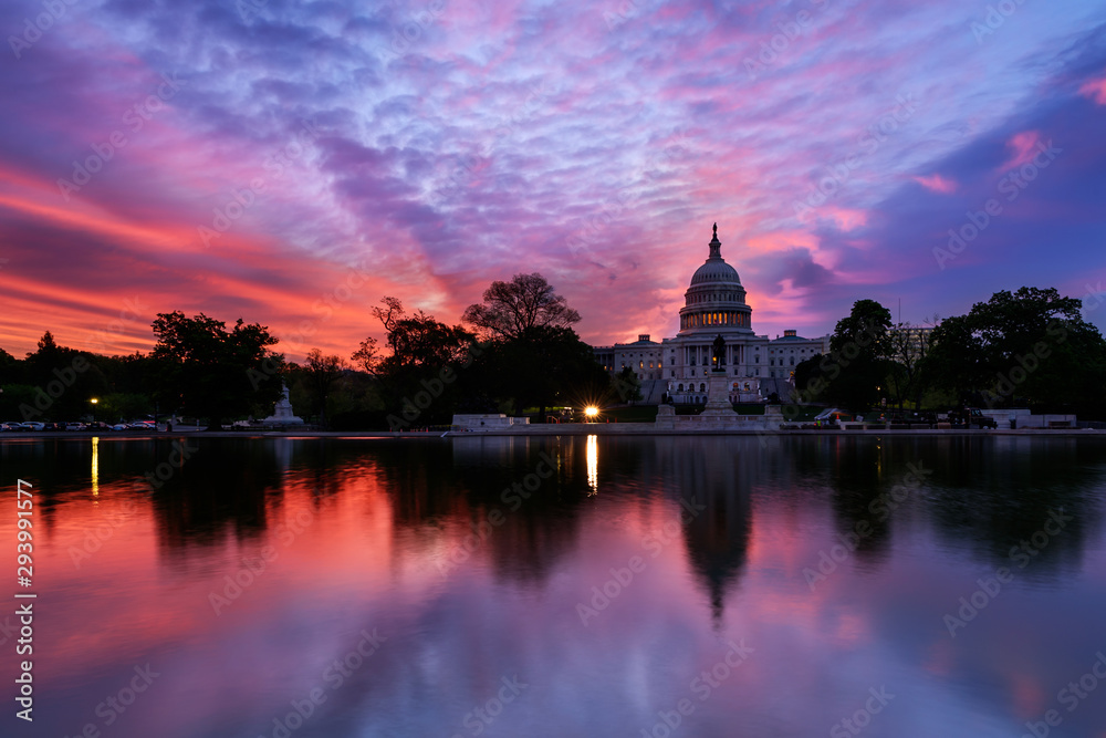 Capitol building with reflection in reflecting pool at sunrise, Washingtom DC