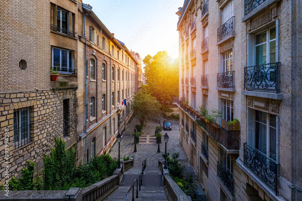 Montmartre district of Paris. Morning Montmartre staircase in Paris, France. Europa. View of cozy street in quarter Montmartre in Paris, France. Architecture and landmarks of Paris. Postcard of Paris.