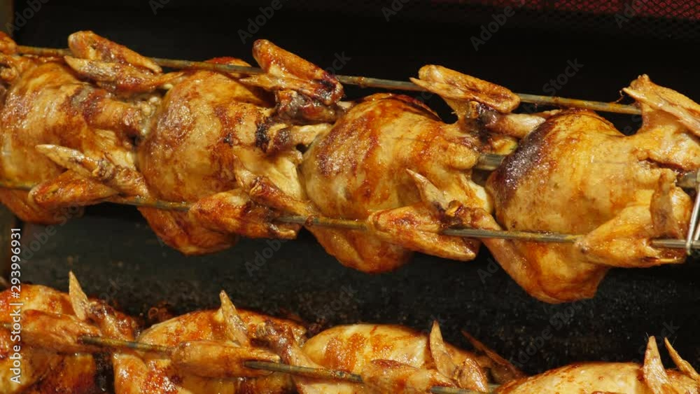 Chicken Rotating On A Skewer on Oktoberfest beer festival. in Munich Chicken Rotating On A Skewer on Oktoberfest beer festival. in Munich