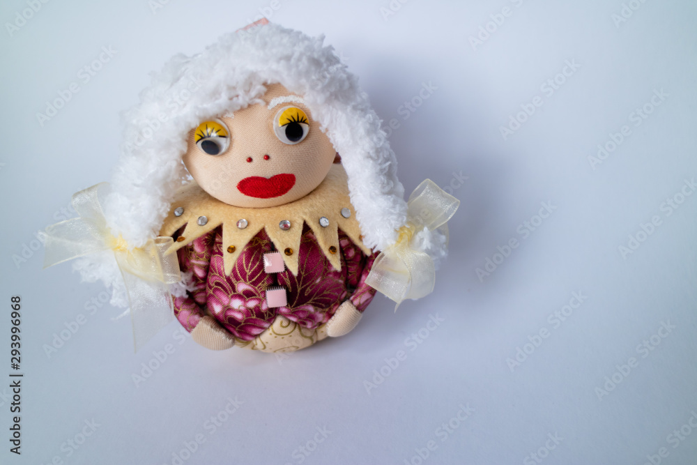 Patchwork Elf decorated with precious stones isolated on white background.