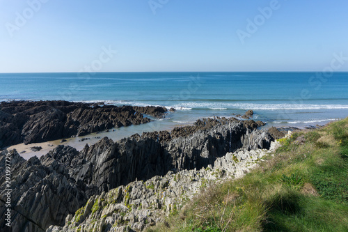 Rugged rocky coastline at Barricane beach in Woolacombe , Devon photo