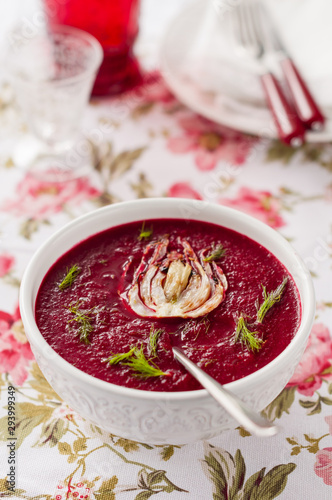 Cream of beetroot soup with sliced fennel and fresh herbs