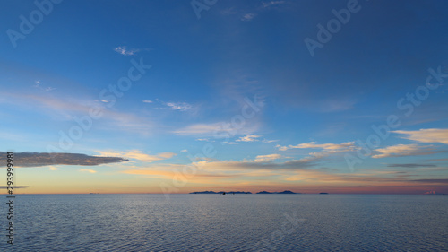 Sunrise in the Salar de Uyuni flooded after the rains  Bolivia. Clouds reflected in the water of the Salar de Uyuni  Bolivia
